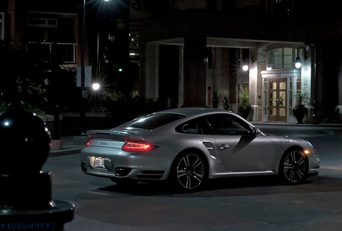 2010 Porsche 911 Turbo rear view parked at night