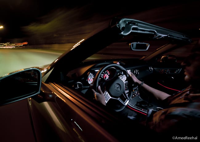 2012 Mercedes-Benz SLK 350 Roadster interior driving at night with the top down