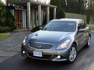 2011 Infiniti G25x parked on driveway in front of nice house