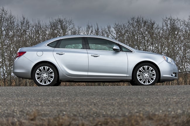 2012 Buick Verano in silver sideview parked on the road