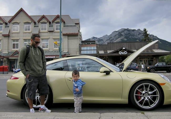 2012 Porsche 911 Carrera S parked in Canmore Alberta with dad and son