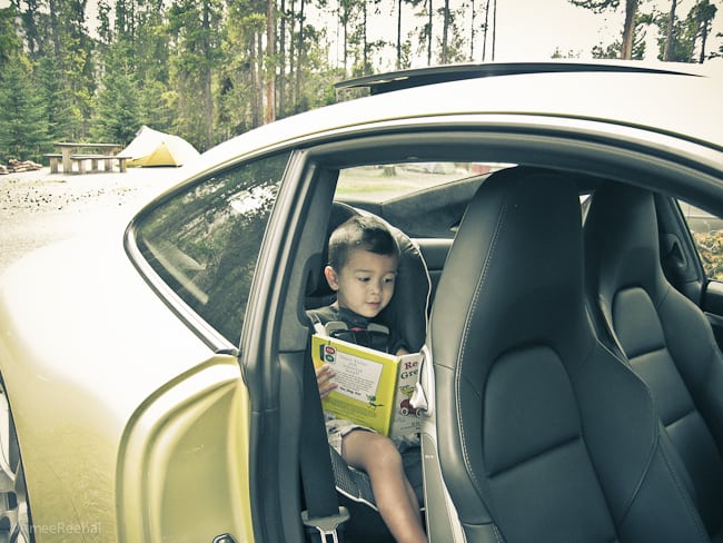 2012 Porsche 911 Carrera S with child in back