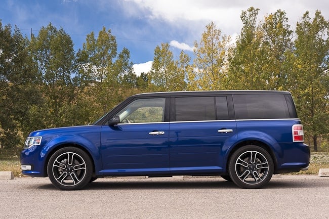 blue 2013 Ford Flex Limited side view parked on road