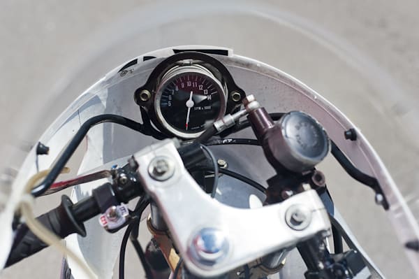 Restored 1977 Honda MT125R GP Racer motorcycle gauges from driver view