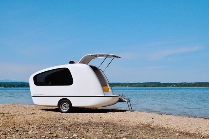 The Sealander RV on the shore with door open