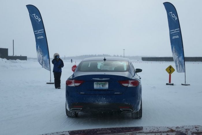 2015 Chrysler 200 off roading in the snow, rear view
