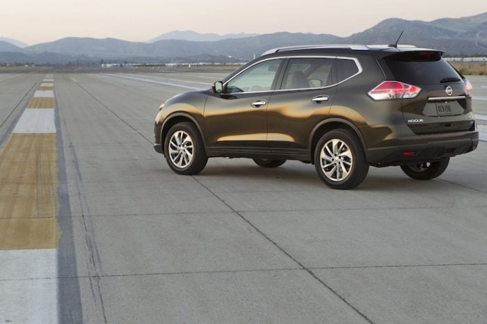 2015 Nissan Rogue rear shot parked on airport strip