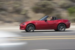 2016 Mazda Miata driving with top down