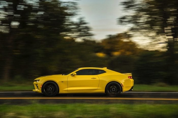 2016-camaro-ss in yellow side view driving on street