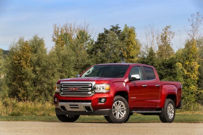 red 2016 GMC Canyon Diesel front view parked on road