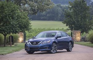 2016 Nissan Altima SR in blue parked in vineyard on the driveway
