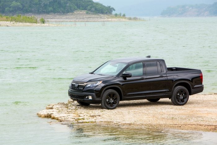 black 2017 Honda Ridgeline Black Edition parked by a lake