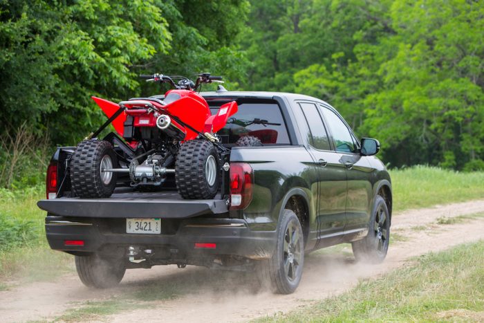 2017 Honda Ridgeline Black Edition rear view with an ATV in the bed