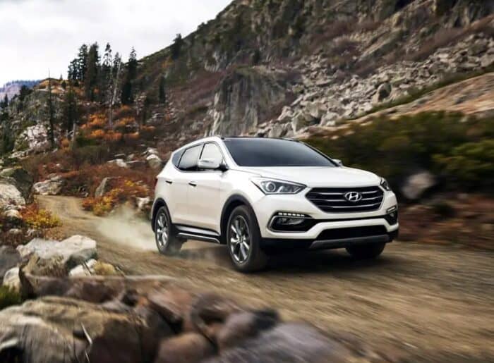 White 2017 Hyundai Santa Fe Sport front view driving on off road