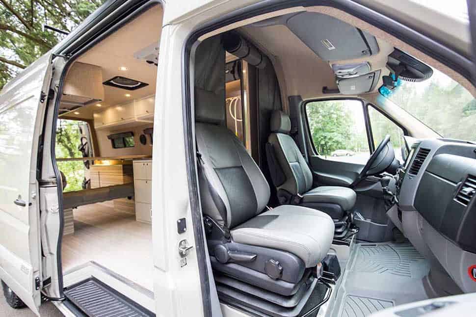 Outside Van Valhalla 4x4 Camper interior view of front and back from outside with doors open