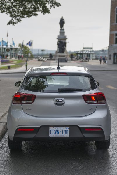 silver 2018 Kia Rio Hatchback rear head on shot parked on street