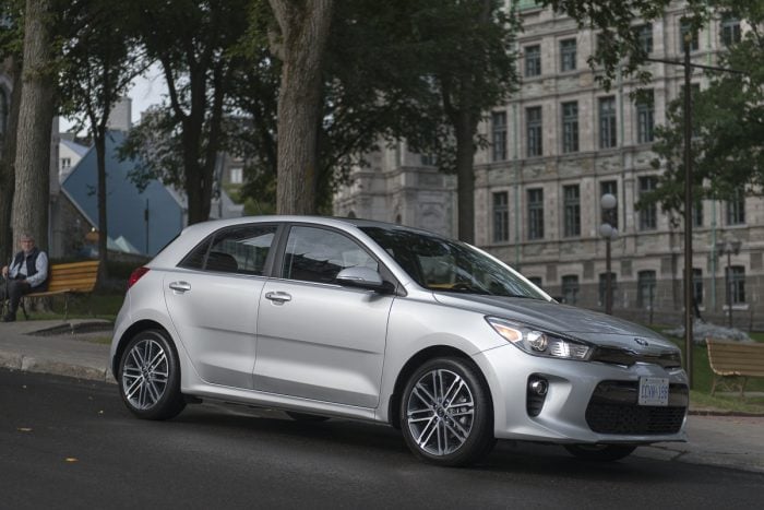 silver 2018 Kia Rio Hatchback side view parked on street