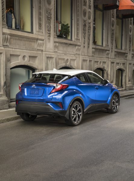 2018 Toyota C-HR rear in blue and white combo parked in front of old building on street