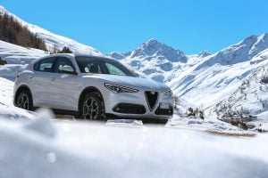 2018 Alfa Romeo Stelvio SUV in white front view parked in mountains