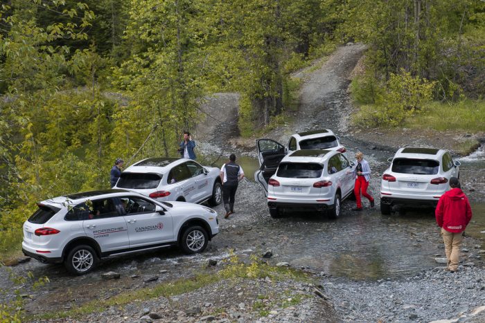 Porsche Travel Experience British Columbia Canada group of white Cayenne SUVs all parked outside