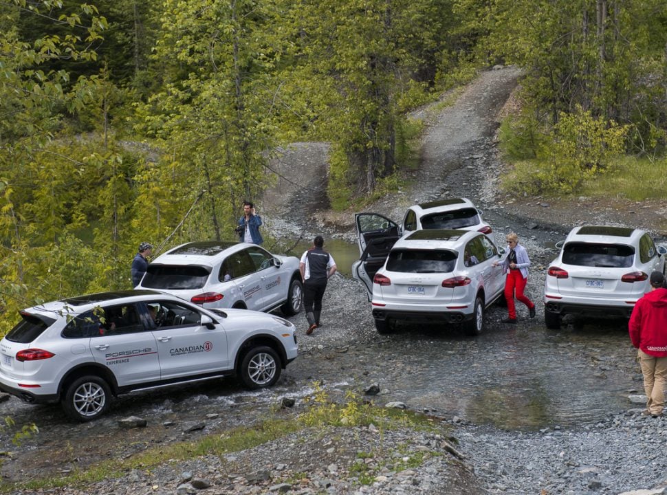 Porsche Travel Experience British Columbia Canada group of white Cayenne SUVs all parked outside