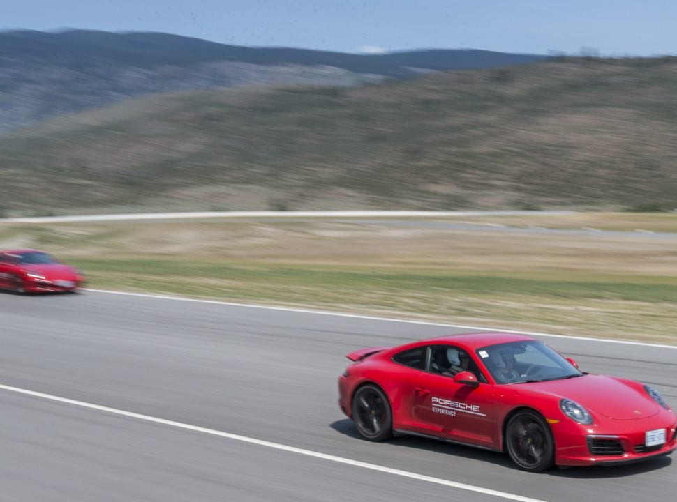 Porsche Travel Experience British Columbia Canada red 911s driving fast on the track at Area 27