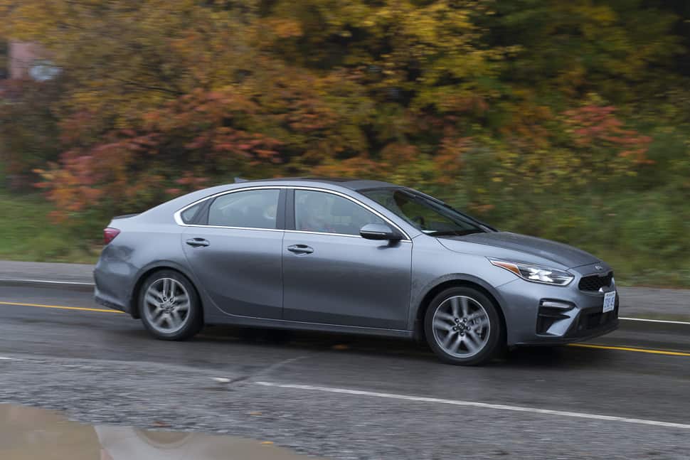 2019 Kia Forte review in grey colour driving down road