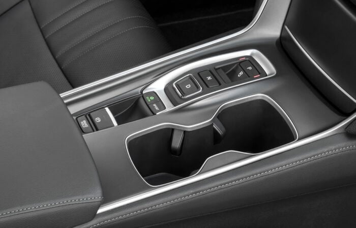 Close-up of 2018 Honda Accord center console with gear shift and control buttons.