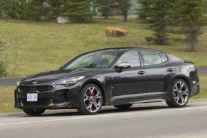 2018 Kia Stinger GT front profile parked in mountains