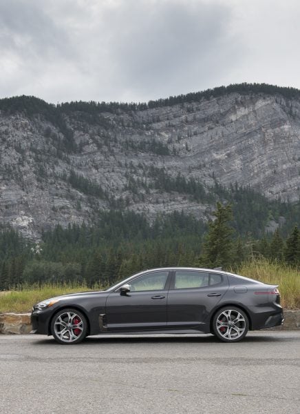 2018 Kia Stinger GT side profile parked in mountains