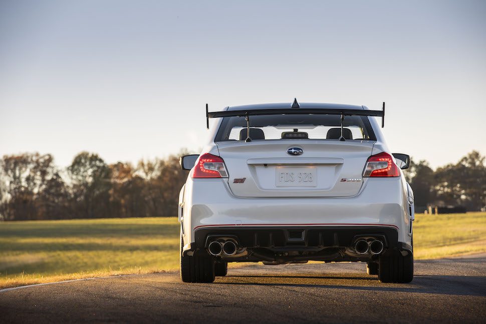 2019 Subaru STI S209 rear view parked outside at sunset