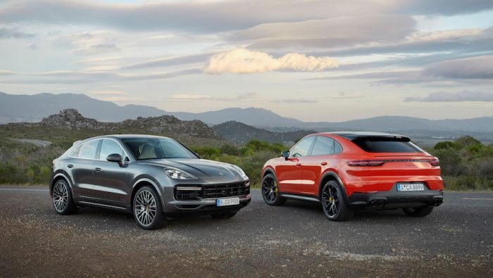 2020 porsche cayenne coupe and coupe sport side by side in mountains