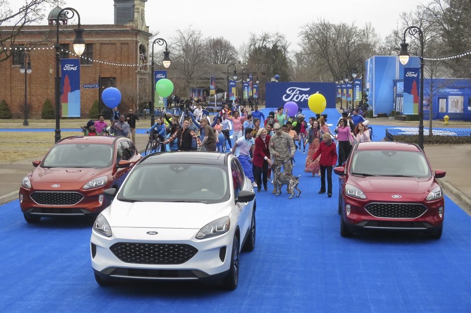 2020 Ford Escape three models together with people celebrating