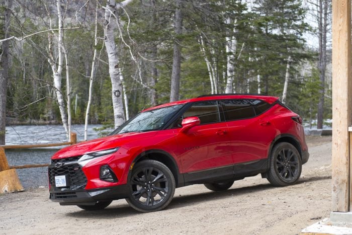 2019 Chevy Blazer RS in red parked by woods