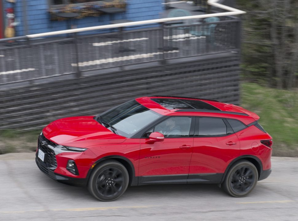 2019 Chevy Blazer RS in red driving up a hill