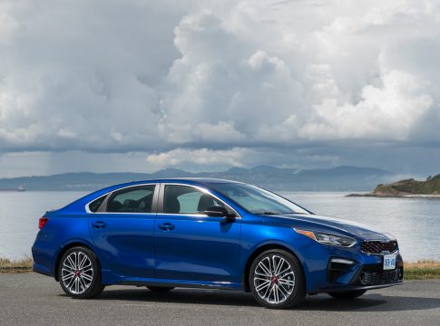 2020 Kia Forte GT front view blue car by ocean