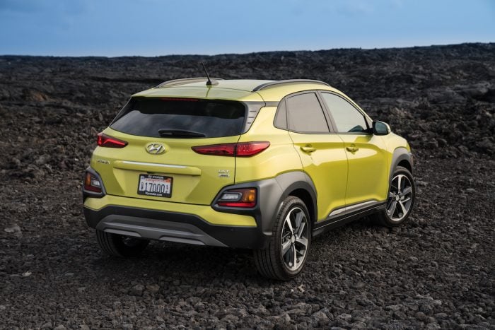 2020 Hyundai Kona in yellow rear view parked outside