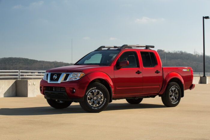 red 2020 Nissan Frontier parked on parkade top level