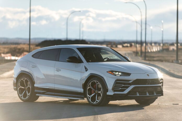 2019 Lamborghini Urus SUV front profile in white parked on street