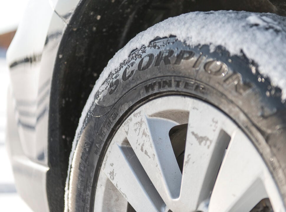 Pirelli Scorpion Winter Tire logo on sidewall with snow on tires