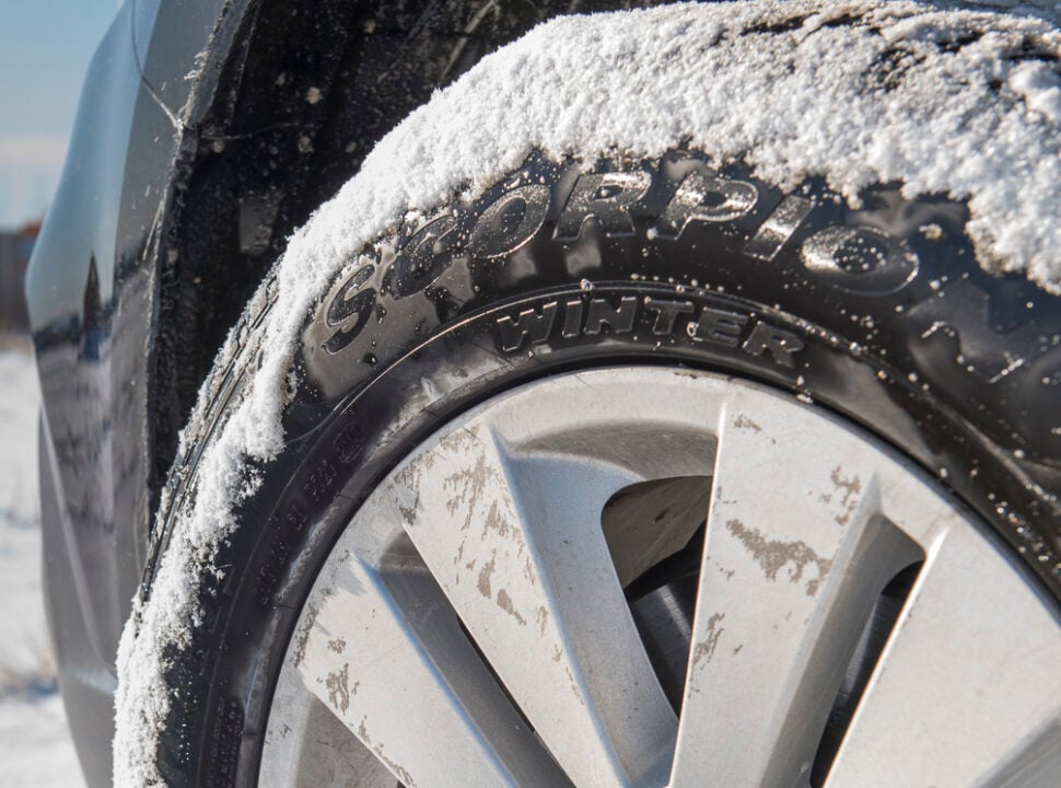 Pirelli Scorpion Winter Tire logo close up on sidewall with snow on tread