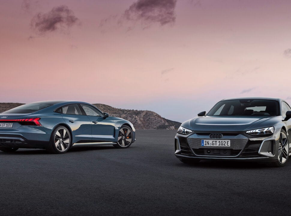 2022 Audi e-tron GT side by side parked outside at sunset