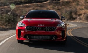 2022 Kia Stinger GT front grill view driving on road