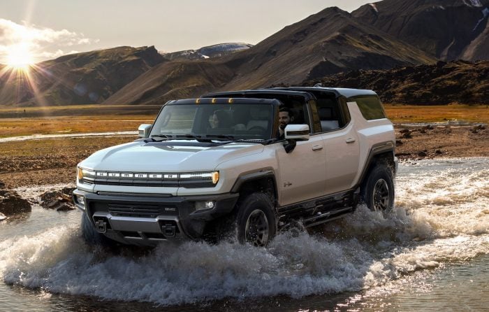 GMC HUMMER EV SUV driving through water