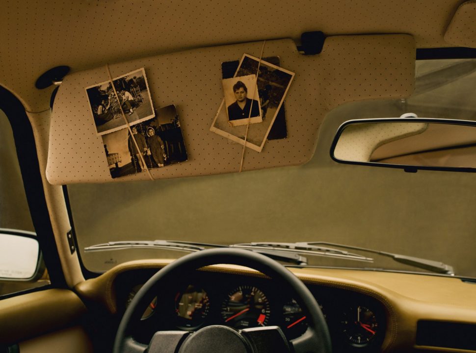 Aimé Leon Dore's retro restored 1978 Porsche 911SC interior and driver side visor with old vintage photos