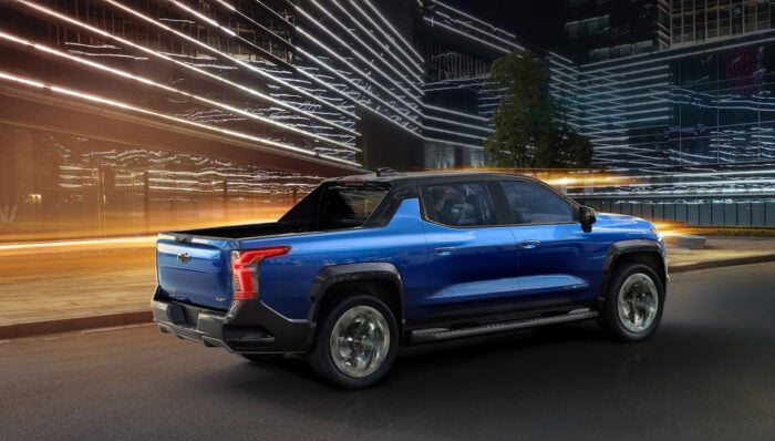 2024 Silverado EV RST driving rear shot