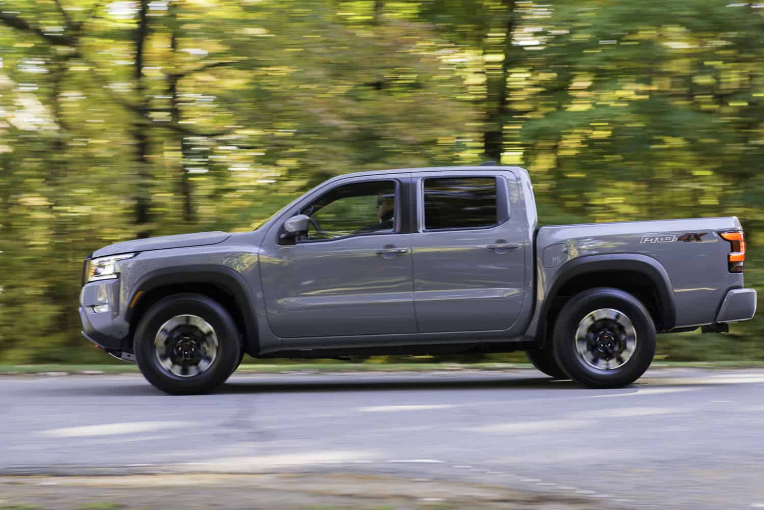 2022 Nissan Frontier grey sideview driving