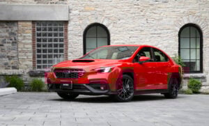 2022 subaru wrx red front view parked on cobblestone roade