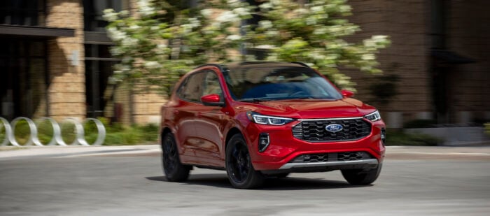 2024 Ford Escape ST-Line Elite in red driving fast on the road