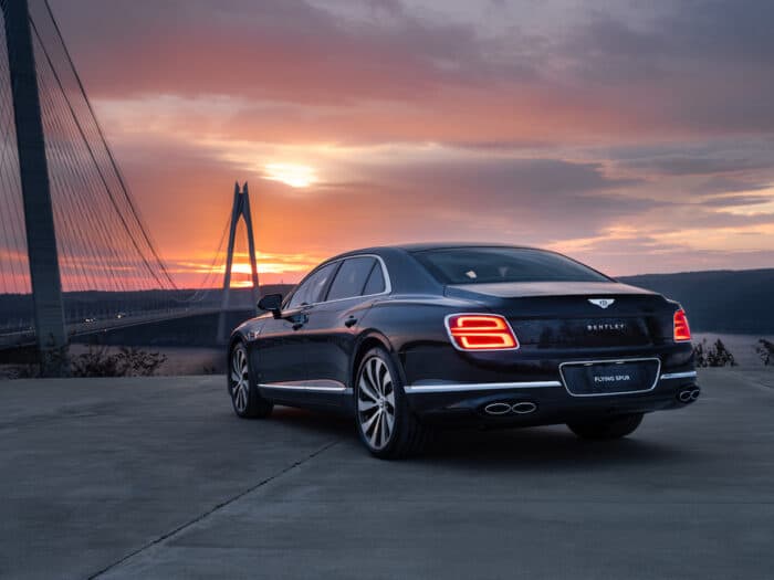 2022 Bentley Flying Spur W12 rear parked on bridge at sunset